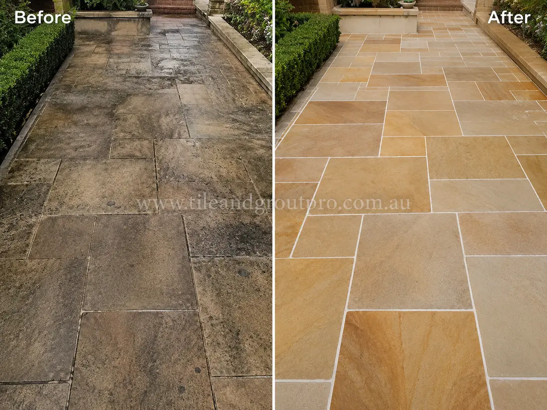 Before tile renewal, the outdoor sandstone pathway tiles appeared heavily weathered with dark staining, grime buildup, and faded colouring in a garden walkway.