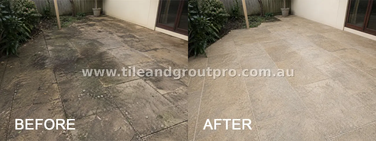 Natural stone courtyard floor tiles with heavy black staining, grime buildup, and weather damage before professional tile and grout cleaning