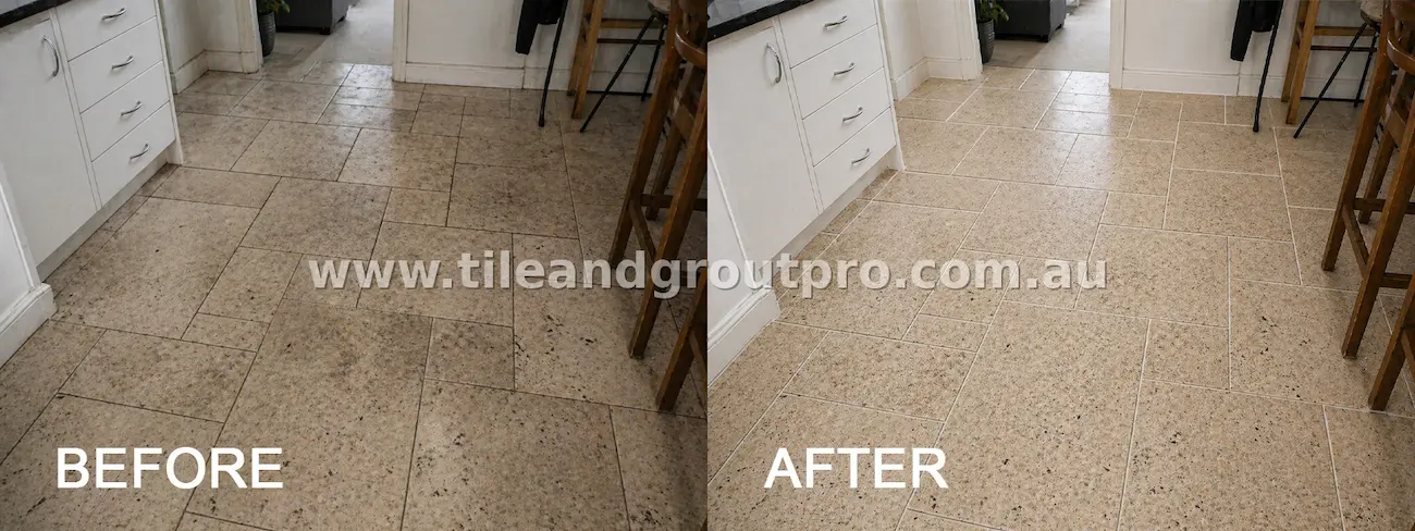 Light natural stone kitchen floor tiles with heavy dirt buildup, dark stains, and discoloured grout lines before professional tile and grout cleaning