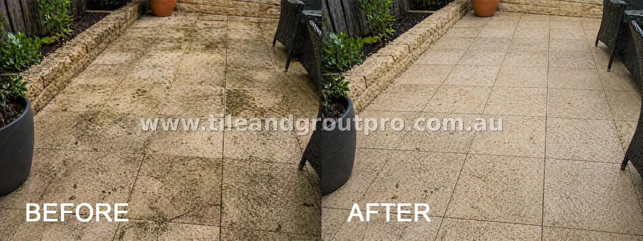 Outdoor natural stone patio tiles with dirt, algae growth, and weather stains on the surface and grout before tile and grout cleaning