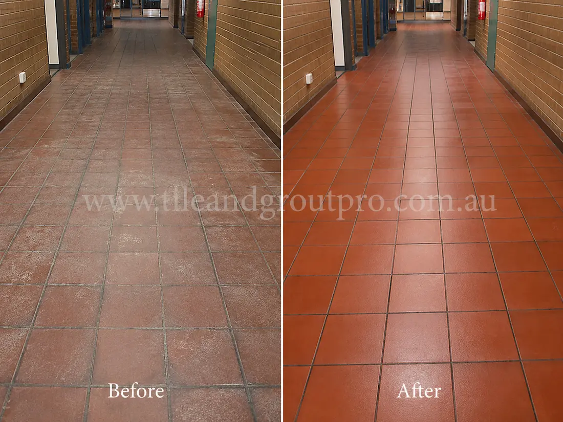 Commercial hallway with red quarry floor tiles showing faded sealer, white residue, and worn traffic areas before Sealer Stripping restoration.