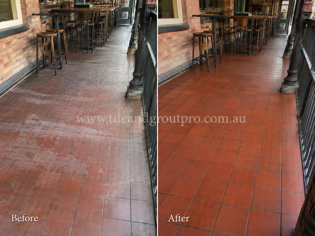 Commercial outdoor verandah with red quarry floor tiles showing faded sealer, white residue, and worn traffic areas before Sealer Stripping restoration.