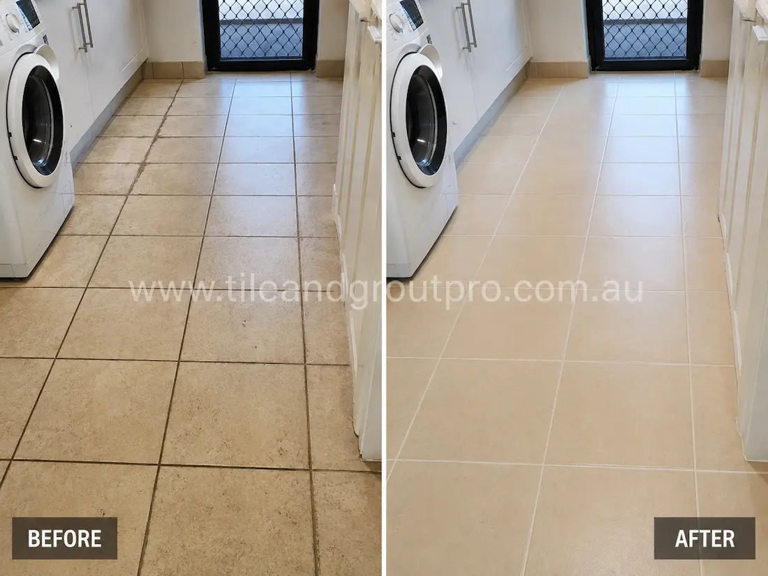 Before tile renewal, a laundry room floor with beige ceramic tiles showed dirty grout lines, accumulated grime, and surface staining around the washing machine and entry doorway.