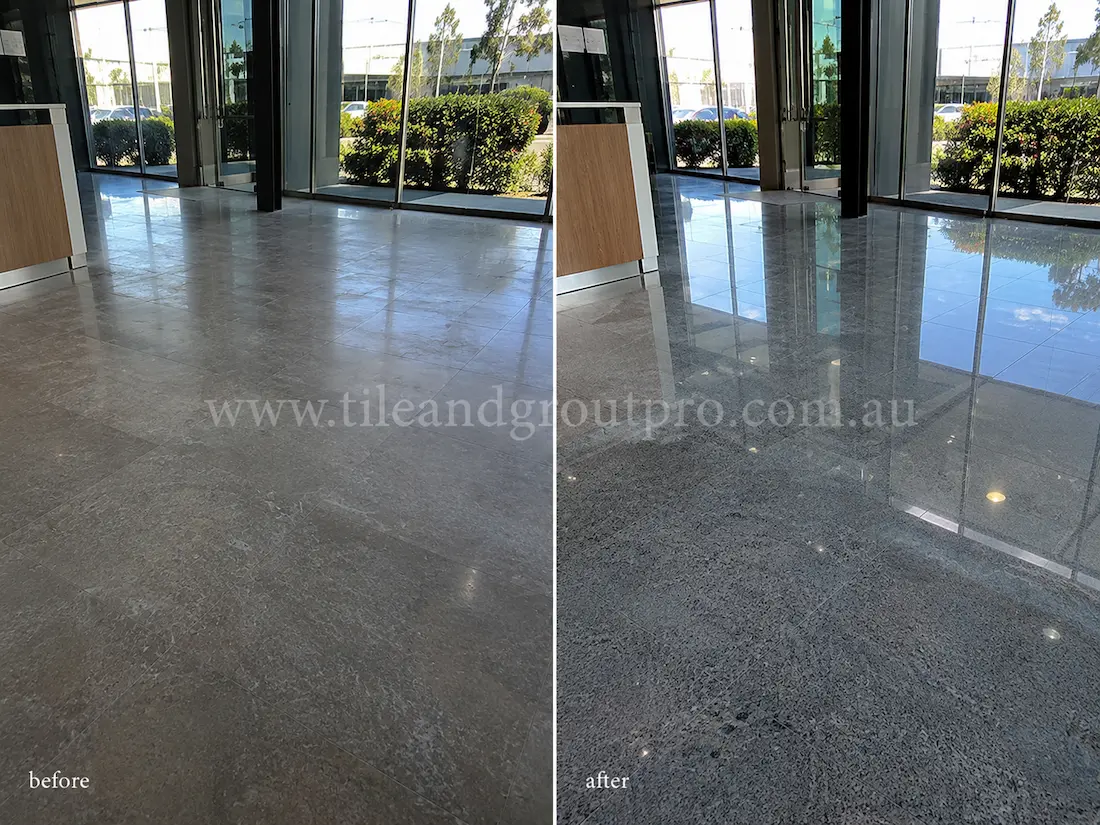 Before tile renewal, the commercial granite lobby floor near the glass entrance showed dullness, light surface wear, and reduced reflectivity across the polished stone tiles.