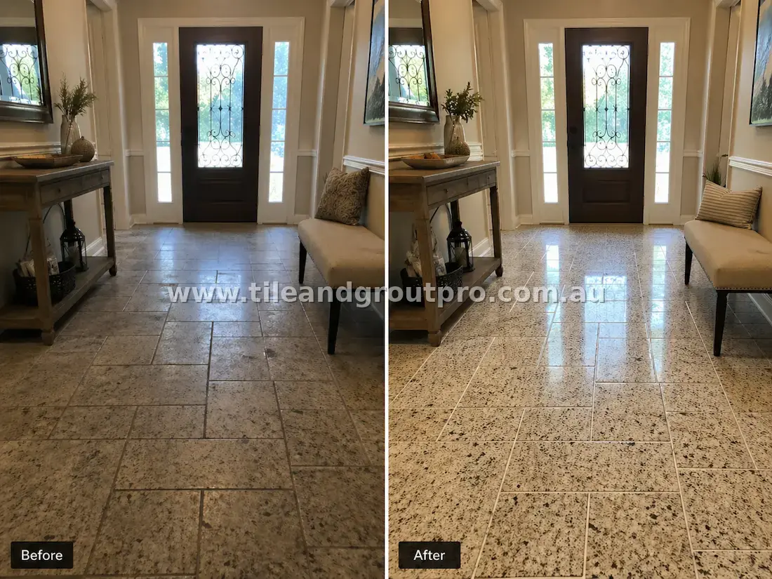 Granite stone tiles in a residential entry hallway with worn surface, dirt buildup, and discolored grout before professional tile and grout cleaning