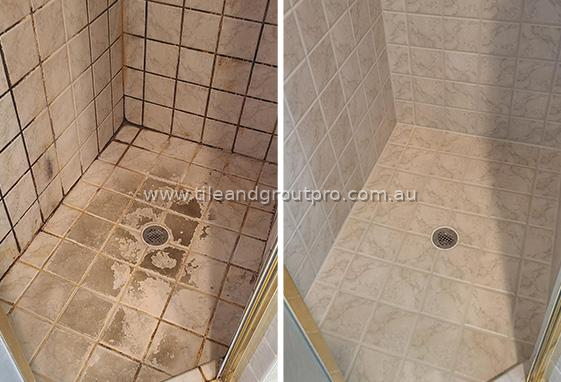 Shower floor tiles before and after grout cleaning and restoration with stains removed and grout brightened