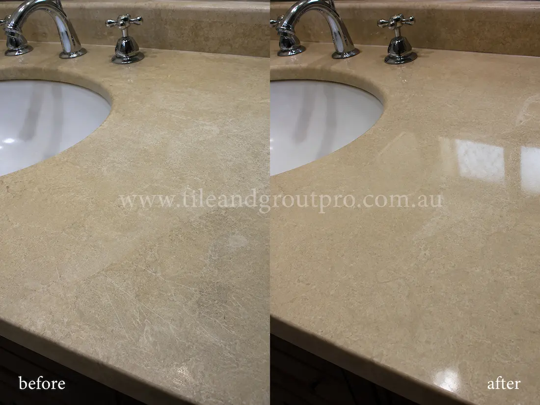 Beige limestone bathroom vanity countertop before and after scratch removal, showing etched and scratched natural stone around a sink restored to a smooth polished finish.