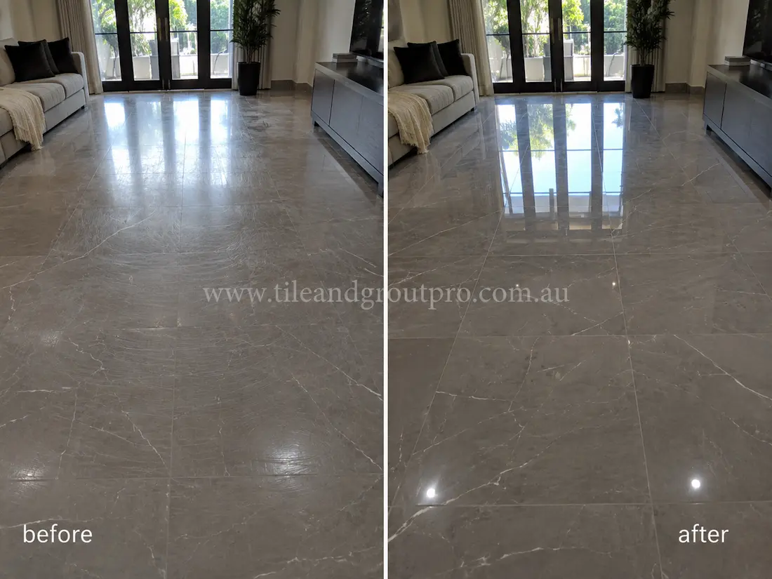 Modern living room with grey marble floor tiles before and after scratch removal, showing visible swirl marks and surface wear refinished to a high-gloss appearance.