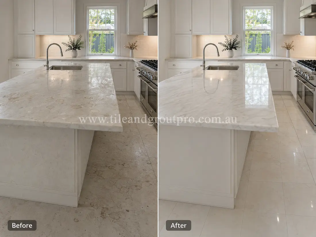 Before tile renewal, the marble kitchen floor and island benchtop appeared cloudy with etching, stains, and reduced polish in a modern white kitchen.