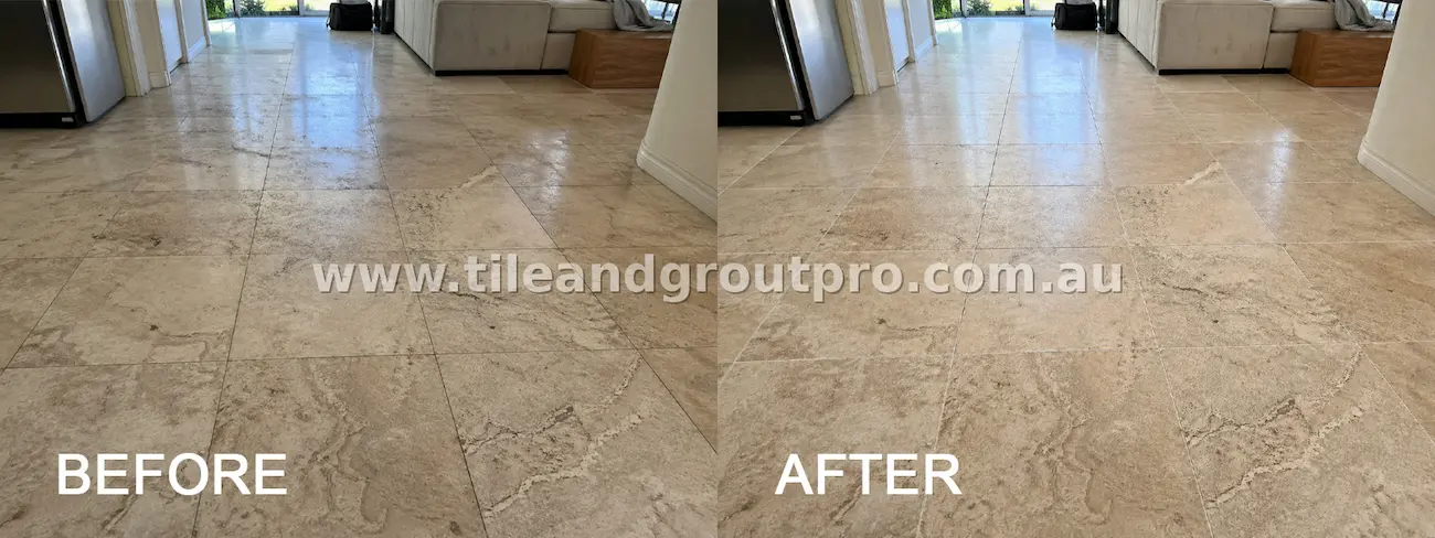 Marble living room floor tiles with dull finish, embedded dirt, and discolored grout across a large open area before cleaning