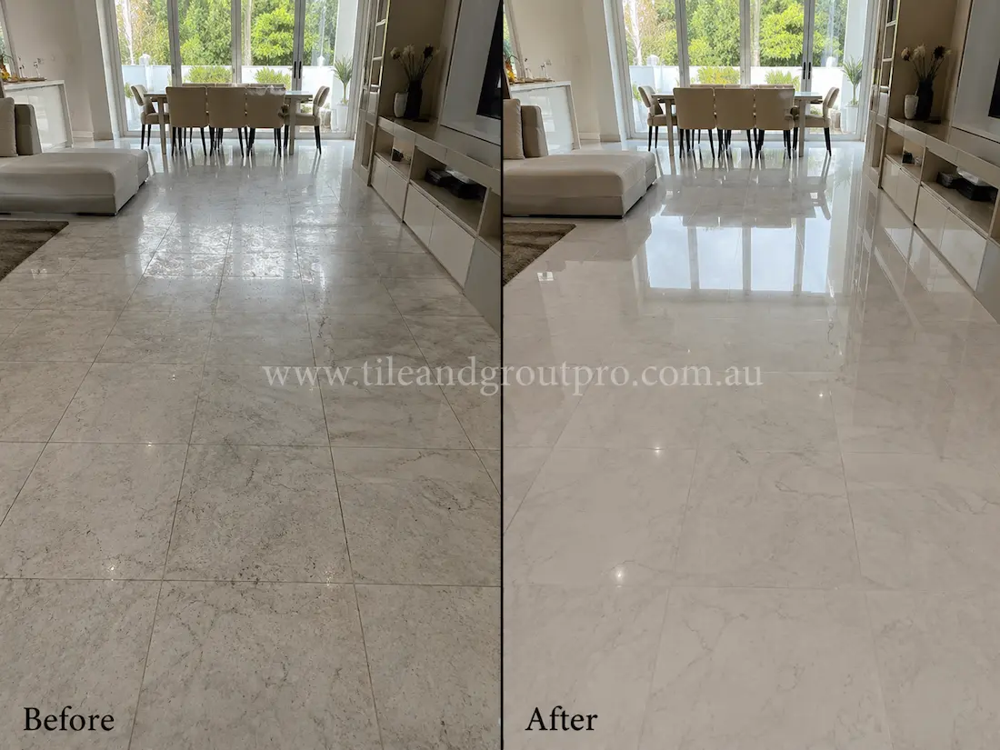 Before tile renewal, the marble living room floor tiles looked cloudy and worn with uneven gloss and visible traffic dullness throughout the open-plan space.