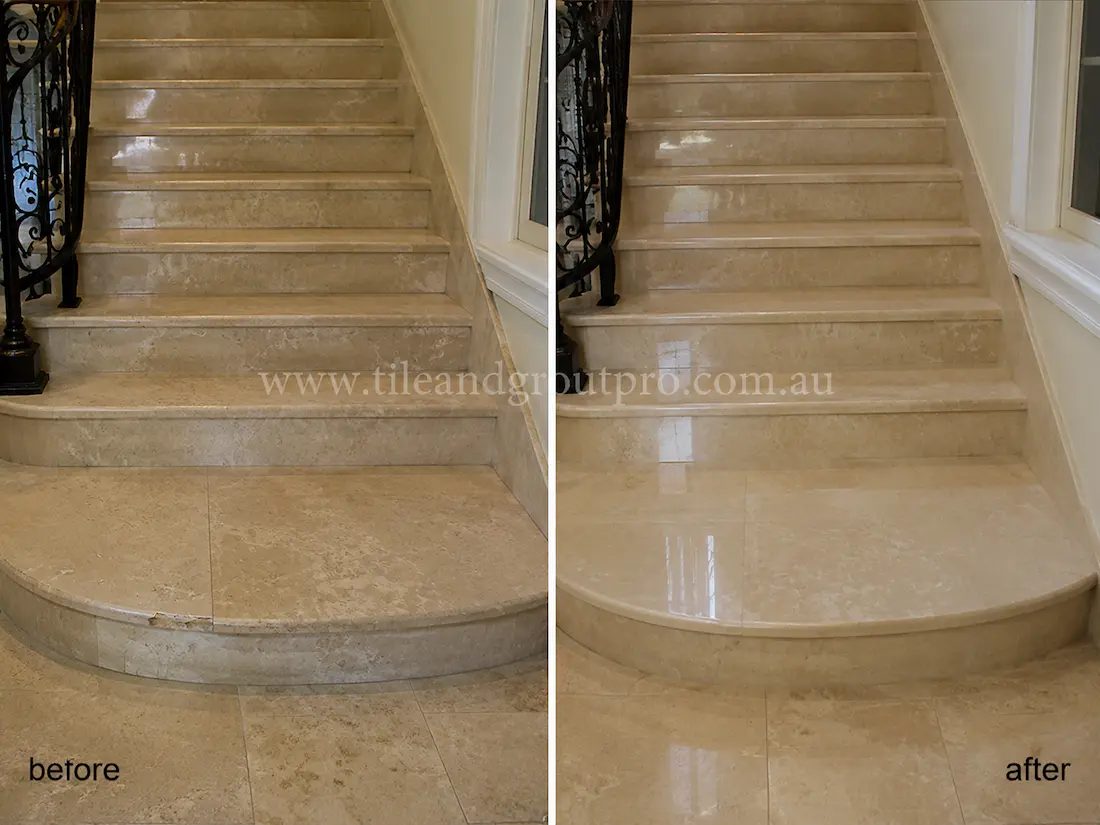 Indoor marble staircase in a residential entryway with worn polish, light surface scratches, and reduced shine before tile resurfacing.