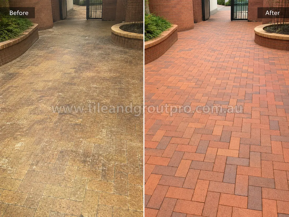 Residential courtyard with herringbone brick pavers before sealer stripping, featuring heavy sealer haze, uneven colour fading, and dull worn brick surfaces near landscaped planters.