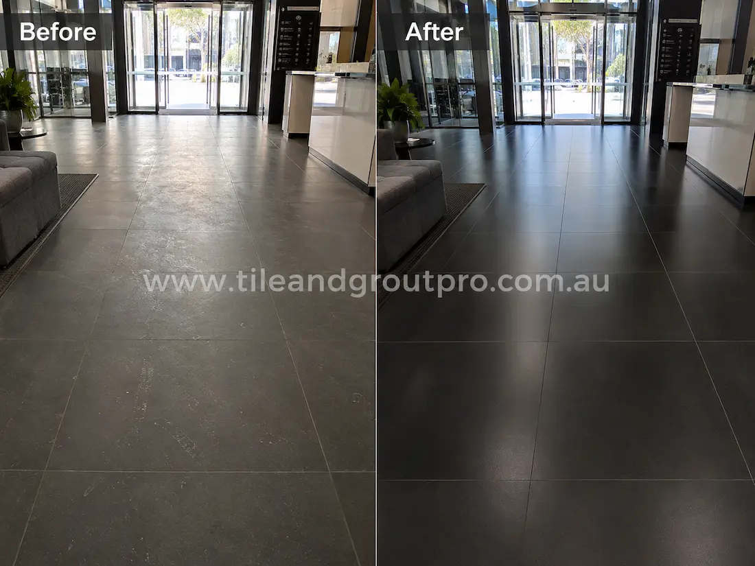 Before tile renewal, dark porcelain floor tiles in a commercial lobby entrance showed dull patches, foot traffic marks, surface scuffs, and an uneven finish that reduced the clean professional appearance.