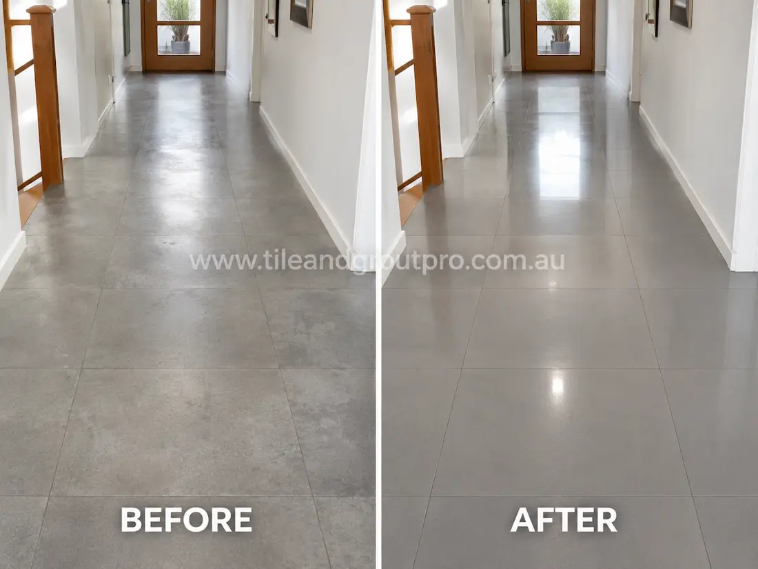 Before stone-polishing of grey porcelain hallway floor tiles with a flat, worn finish and muted appearance leading toward a timber-framed glass door.