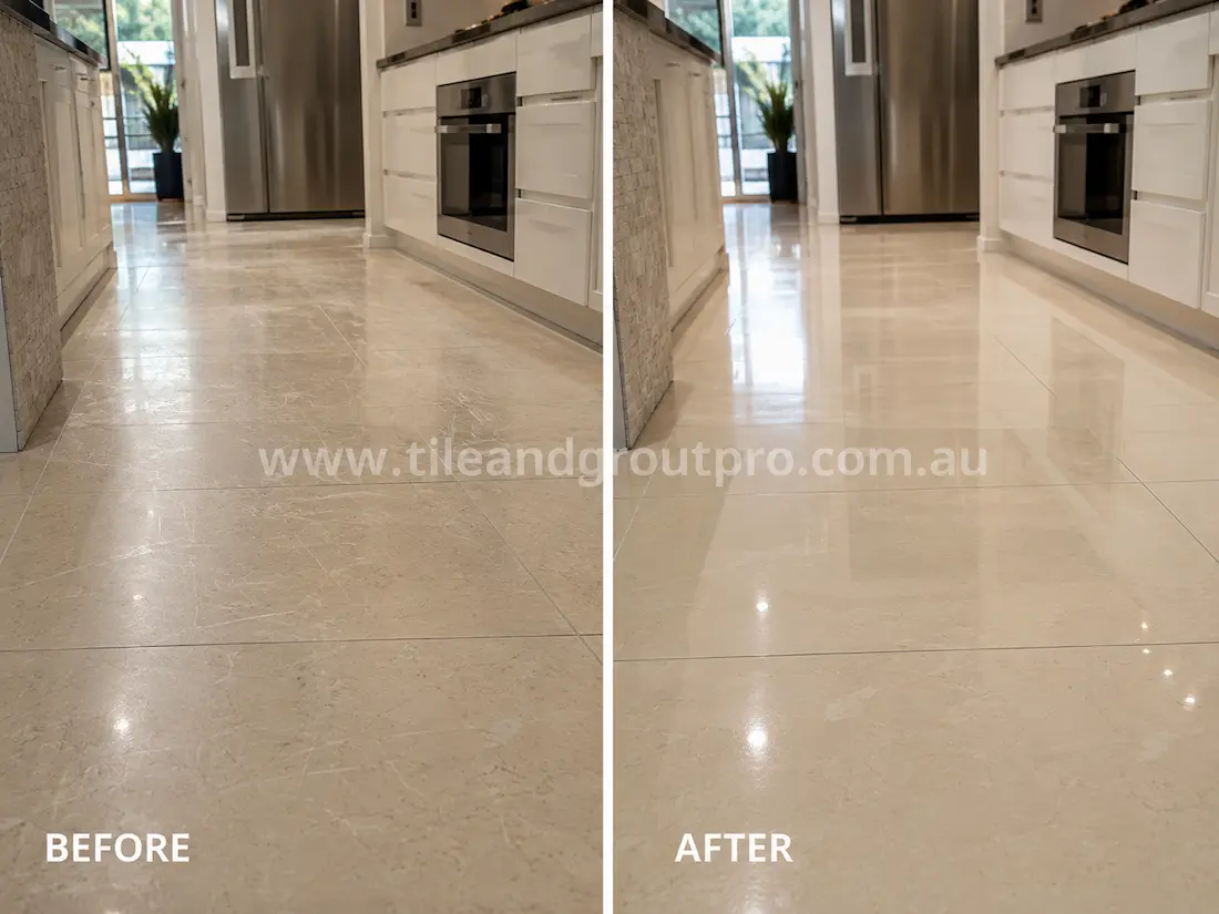 Residential kitchen with polished stone-look floor tiles showing visible scratches, scuffs, and worn finish before professional scratch removal treatment.