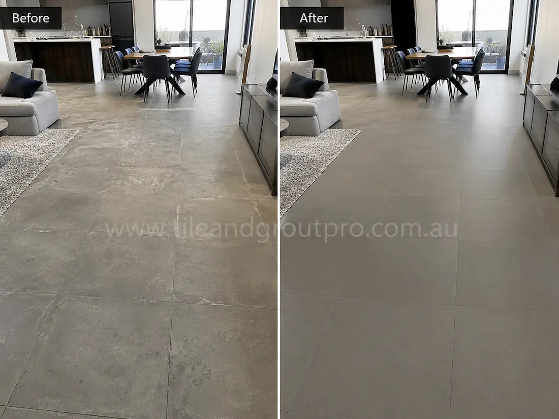 Before tile renewal, large-format stone-look porcelain floor tiles in an open-plan living and dining area appeared faded with light staining, traffic wear, and a muted surface finish.