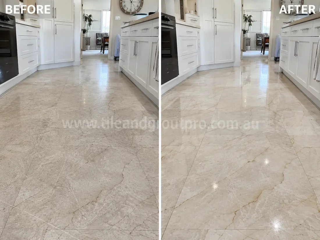 Grey quartzite floor tiles in a modern commercial lobby showing visible surface scratches and dull wear before professional scratch removal service.