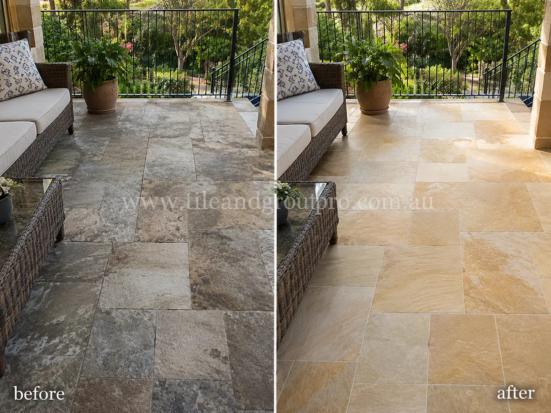 Before tile renewal, covered outdoor sandstone patio tiles beneath wicker lounge furniture showed heavy discolouration, cloudy stone surfaces, and weathered natural stone texture in a residential entertaining area.