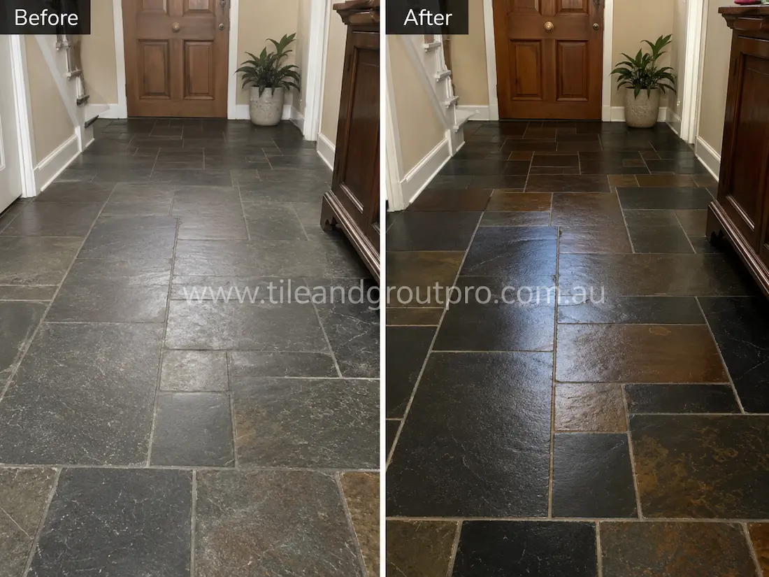 Before stone-polishing of black slate floor tiles in a residential entryway with faded finish, surface scuffs, and inconsistent stone colouring.