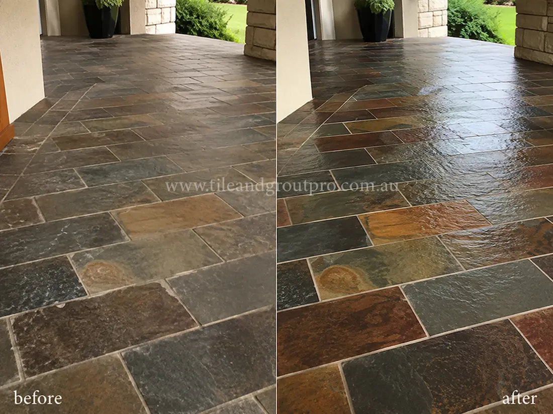 Before tile renewal, natural slate hallway floor tiles displayed a faded finish, surface wear, and reduced colour definition in an indoor residential corridor with painted walls and timber doors.