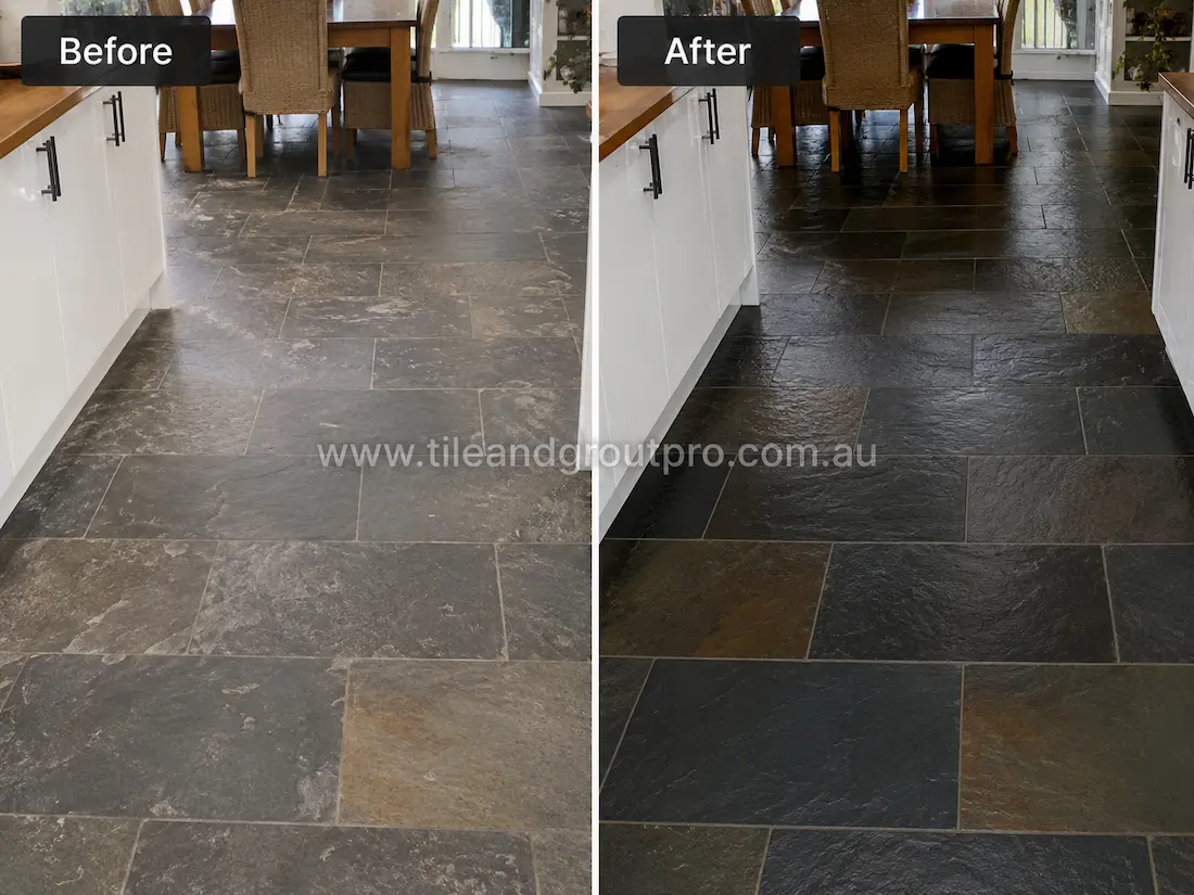 Before stone-polishing of natural slate kitchen floor tiles with dull finish, faded colour variation, and visible wear in a modern white kitchen.