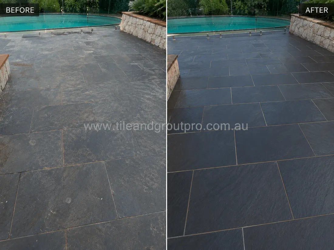Before slate tile resurfacing, this poolside area features dark slate pavers with weathering, faded colouring, surface dullness, and mineral residue from prolonged outdoor exposure near the swimming pool.