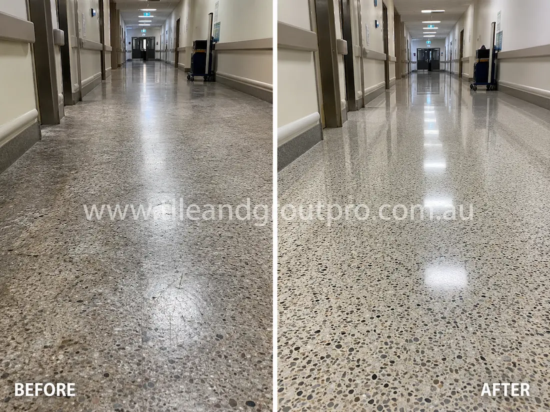 Hospital corridor terrazzo floor before grinding, featuring scratched and faded aggregate flooring with low shine and visible wear along the healthcare hallway.