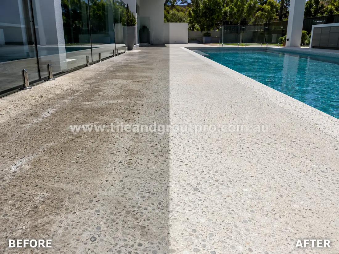 Outdoor poolside terrazzo flooring before grinding, featuring weathered exposed aggregate concrete with stains, surface wear, and uneven colour beside the swimming pool.