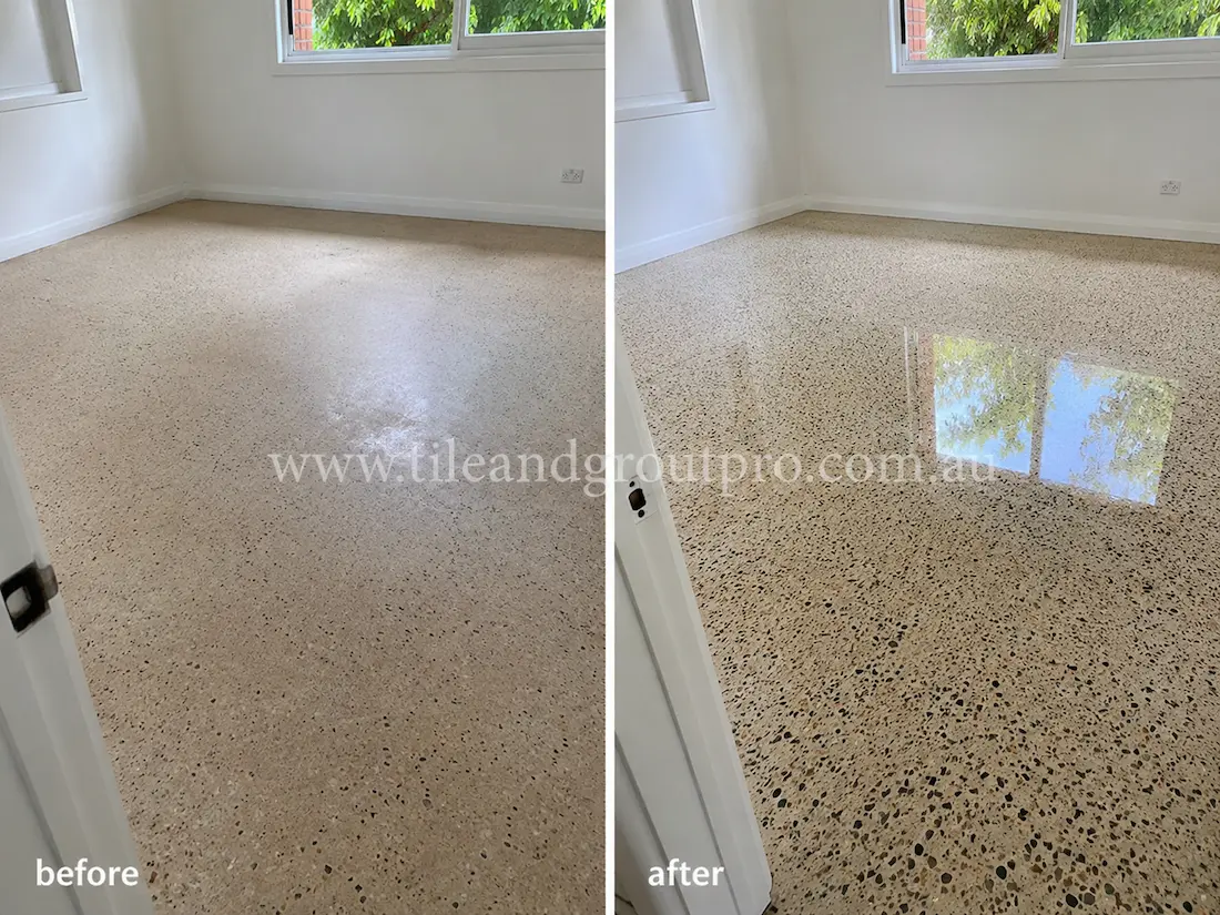 Before tile renewal, the residential terrazzo bedroom floor appeared dull and lightly stained with reduced shine and uneven surface reflection near the window.
