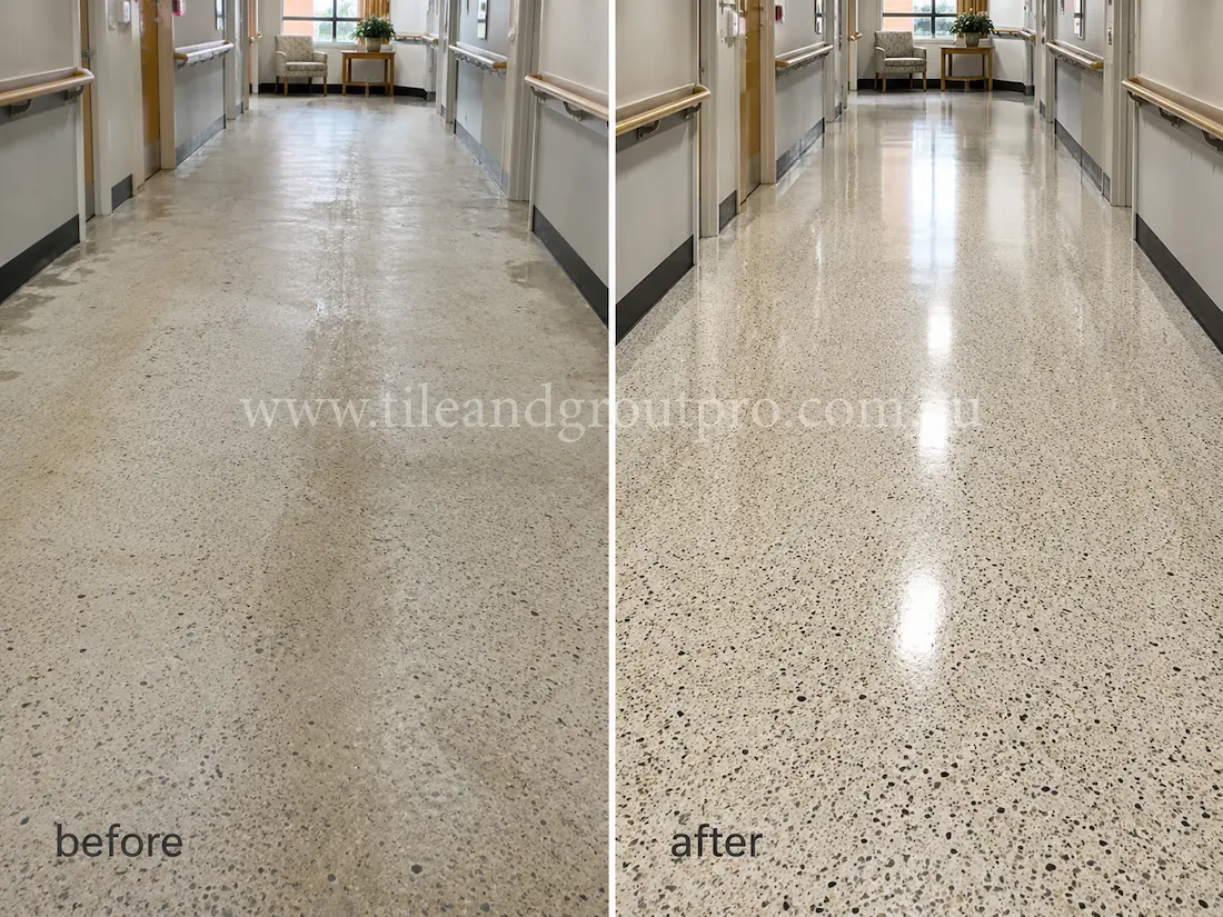 Commercial entryway corridor with terrazzo flooring showing dullness, traffic wear, stains, and reduced shine before professional terrazzo tile resurfacing and polishing.
