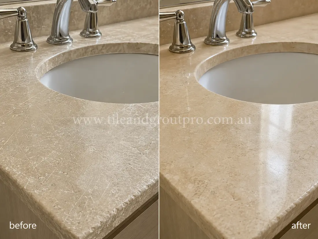 Bathroom vanity with beige travertine stone countertop before and after scratch removal, showing visible surface scratches and dull wear restored to a smoother polished finish. 