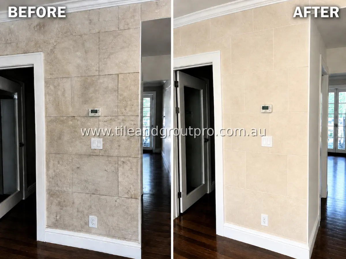 Interior entryway wall with large ceramic tiles displaying dirt buildup, smudges, and dull finish before professional tile and grout cleaning