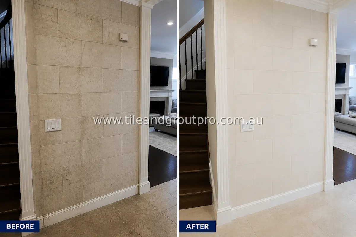 Hallway wall with large ceramic tiles showing heavy soil buildup, smudging, and discolored grout lines before professional tile and grout cleaning