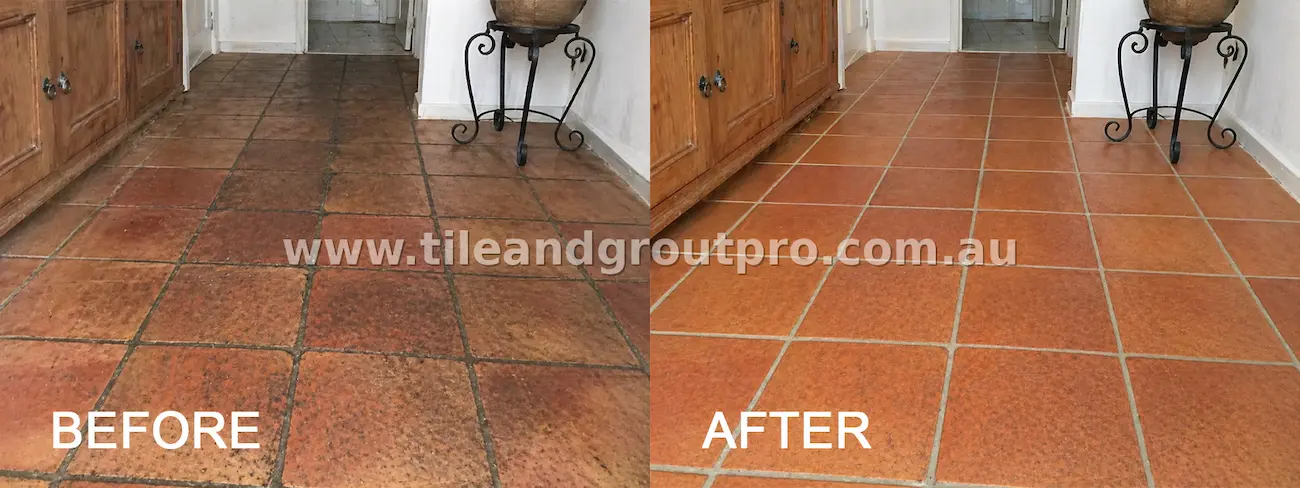 Terracotta hallway floor tiles with worn surface and dark grout before tile and grout cleaning service
